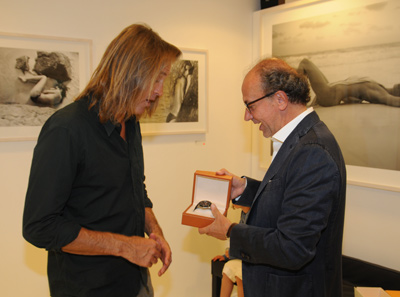 Etienne Gaye presents Russel James with a Ebel watch