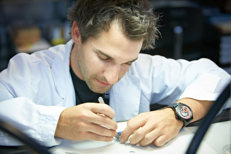 Timo Glock receiving his training in watch movement assembly – and displays great talent!