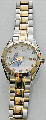 Rotary watch on dial which a young Gaddafi salutes